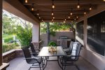Large back patio with multiple sitting areas